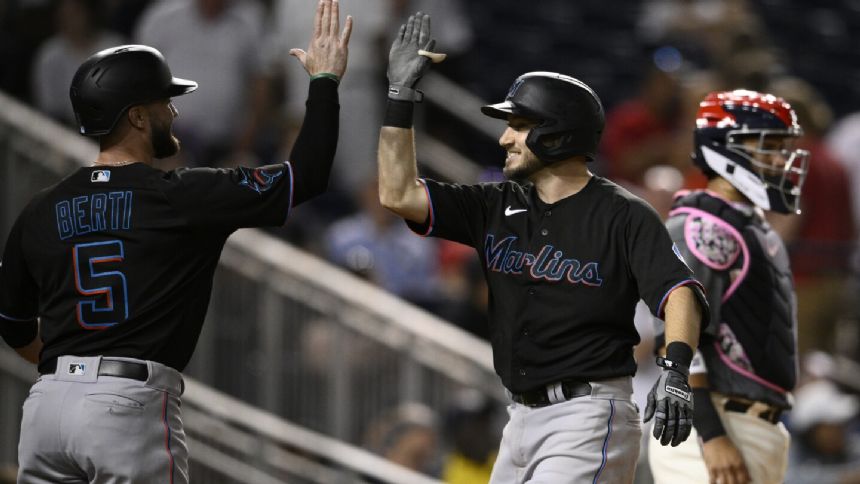 Hampson's 2-run HR caps 11th inning rally and sends Marlins past Nationals 8-5