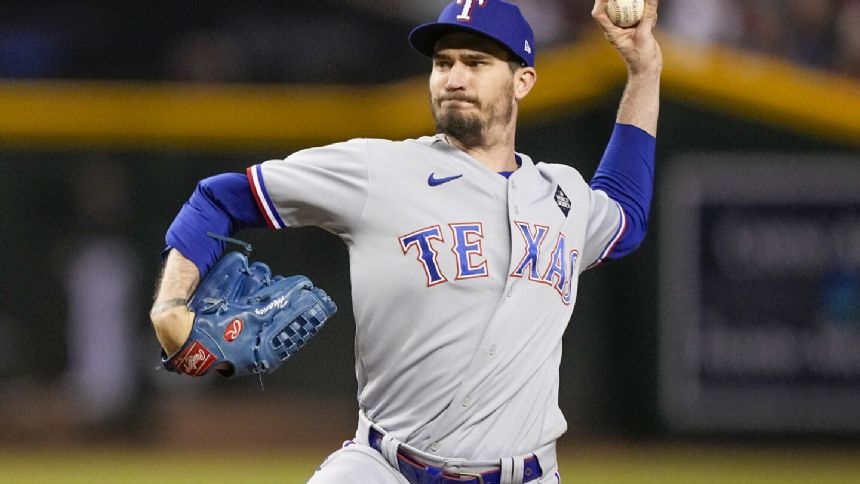Heaney opts in for $13M to stay with Rangers, and World Series champs exercise option for Leclerc