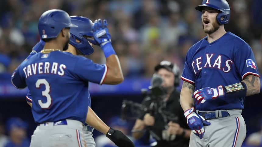 Heim launches grand slam, Carter hits 1st career home run as the Rangers beat the Blue Jays 10-4