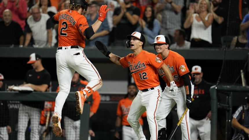 Henderson and Rodriguez help Orioles go a game up on Rays in AL East with 8-0 victory