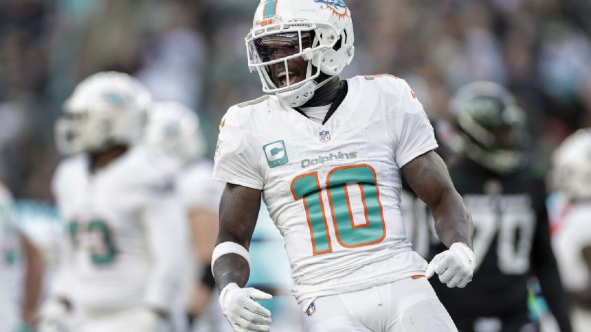 Hill's special TD catch and Holland's 99-yard INT return lead Dolphins past Jets 34-13