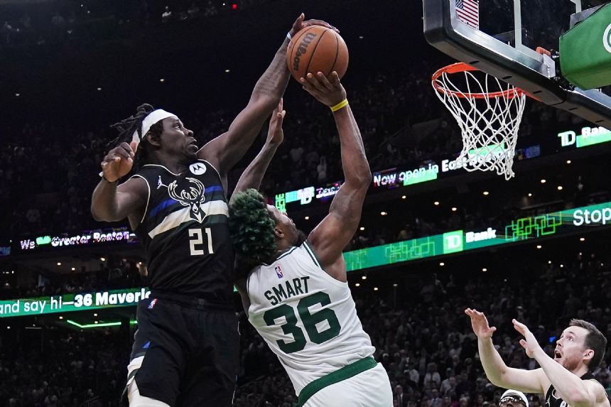 Holiday, Bucks beat Celtics; Grizzlies avoid elimination