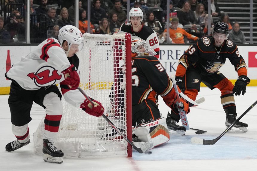 Hughes, Bratt lead Devils' 6-2 rout of Ducks