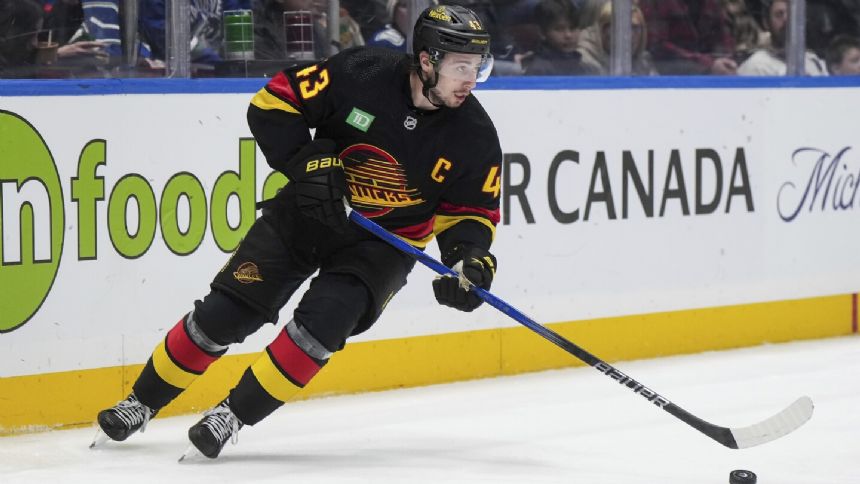 Hughes has goal and assist as Canucks beat Sharks 3-1