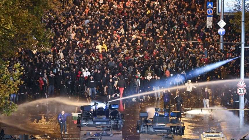 Hungary qualifies for Euro 2024 with own-goal in stoppage time in match marred by violence