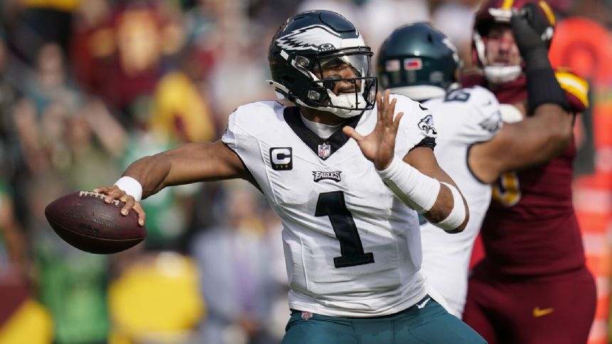 Hurts throws for 4 TDs on injured knee to help the Eagles beat the Commanders and improve to 7-1