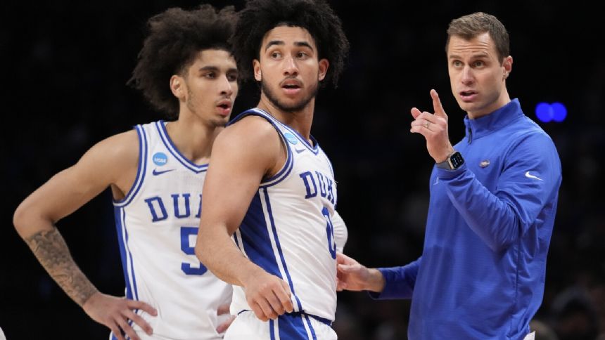 It's a Tobacco Road showdown in Big D between Duke and N.C. State for a spot in the Final Four