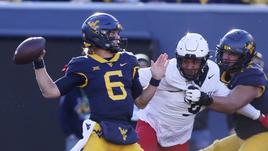 Jahiem White and Garrett Greene run wild in West Virginia's 42-21 romp over Cincinnati