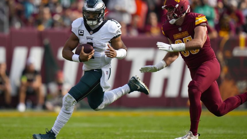 Jalen Hurts and his injured left knee raise concern even with the Eagles at 7-1
