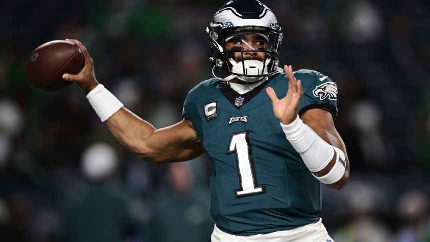 Jalen Hurts runs for 2 TDs, throws for a score; Eagles hold off fumble-prone Vikings 34-28