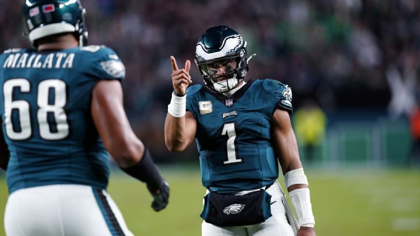 Jalen Hurts shakes off knee injury and leads Eagles past Cowboys 28-23 for NFL best 8-1 mark