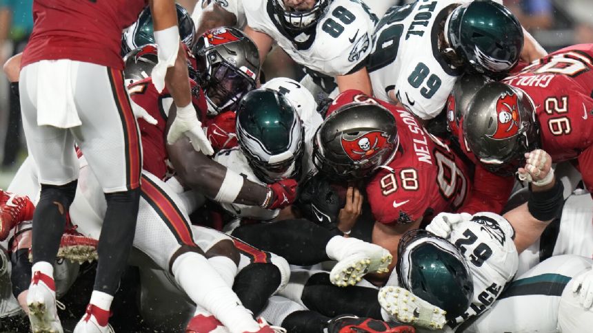 Jalen Hurts throws for TD, runs for another as Eagles thump Buccaneers 25-11 to remain unbeaten