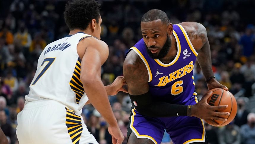 James rallies Lakers past Pacers 124-116 after suspension