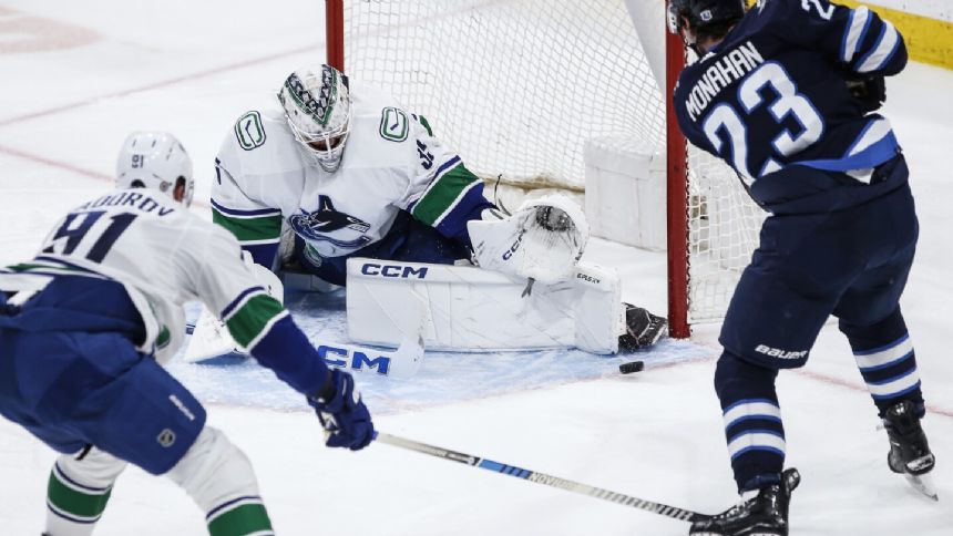 Jets beat Canucks 4-2 in the regular-season finale for the playoff-bound teams