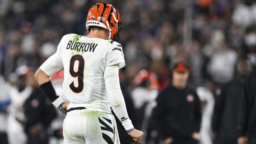 Joe Burrow is out for the rest of the season with a torn ligament in his throwing wrist, Bengals say