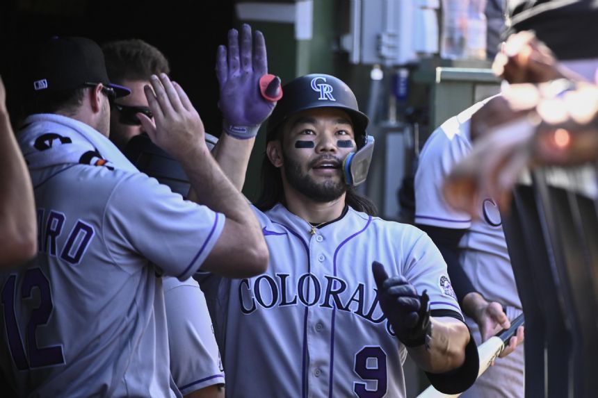 Joe, Grichuk lead Rockies over Cubs 4-3 for rare road win