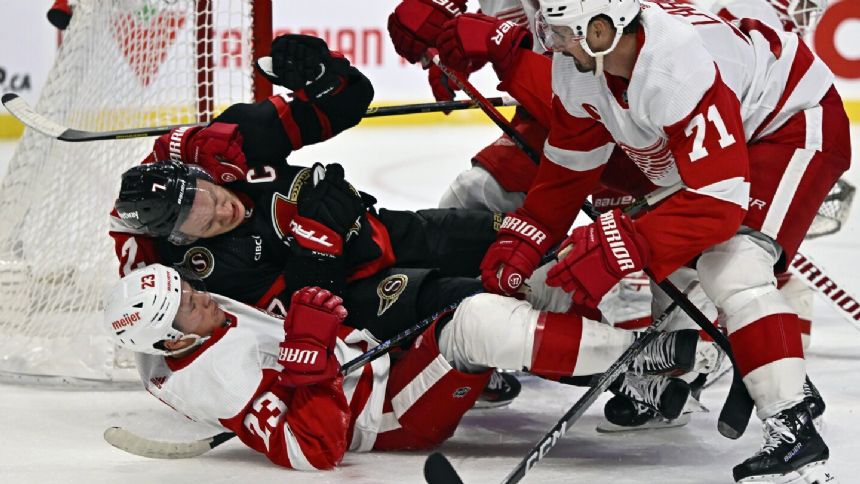 Joe Veleno scores twice and Ville Husso makes 35 saves as the Red Wings beat the Senators 5-2