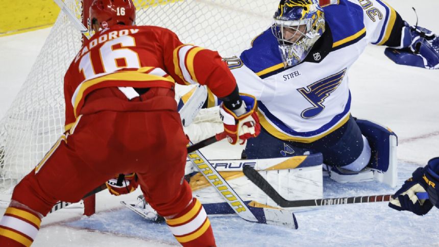 Joel Hofer makes 26 saves in 1st career shutout as Blues blank Flames 3-0