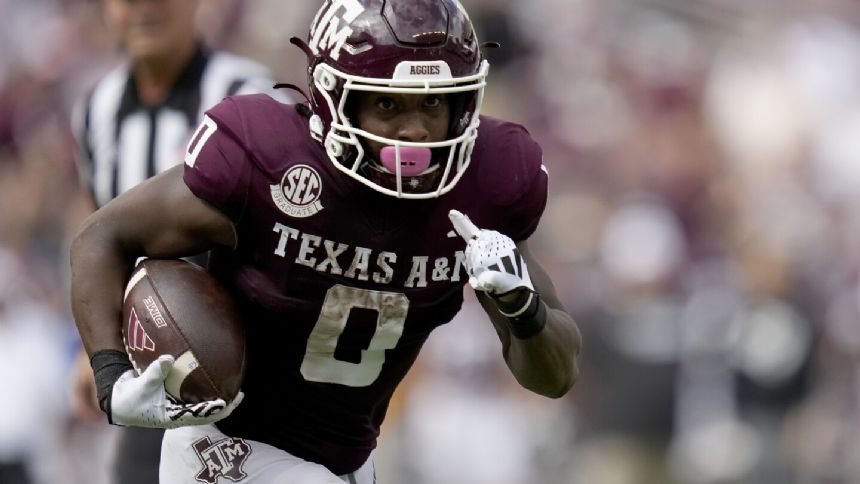 Johnson throws for 249 yards and TD as Texas A&M gets 30-17 win over South Carolina