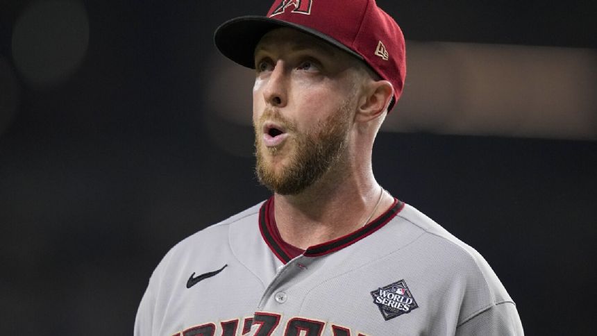 Kelly dominates, Marte, Pham sparks offense, Diamondbacks beat Rangers 9-1 to tie World Series 1-1