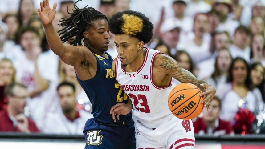 Klesmit scores 21 in 1st half, Wisconsin outrebounds No. 3 Marquette in 75-64 win