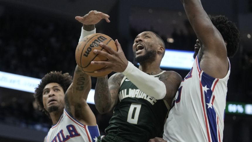 Lillard sets Bucks record with 39 points in a debut, leads Milwaukee past Philadelphia 118-117