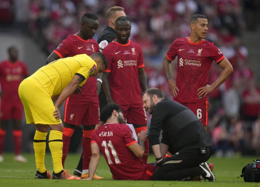 Liverpool forward Salah goes off injured during FA Cup final