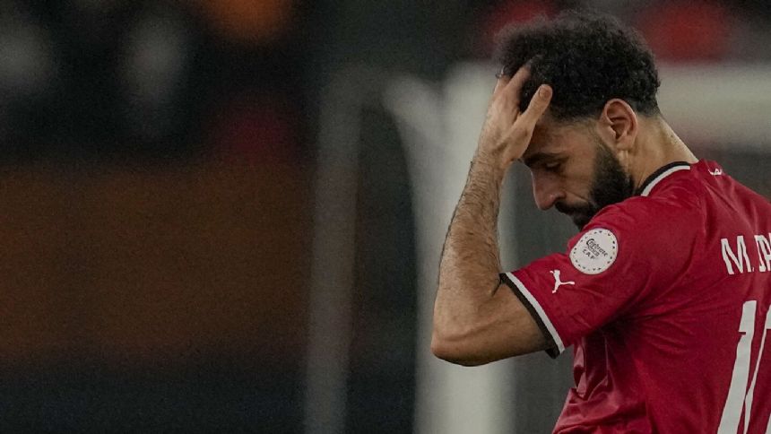 Liverpool says injured Salah returning to England from Africa Cup for treatment