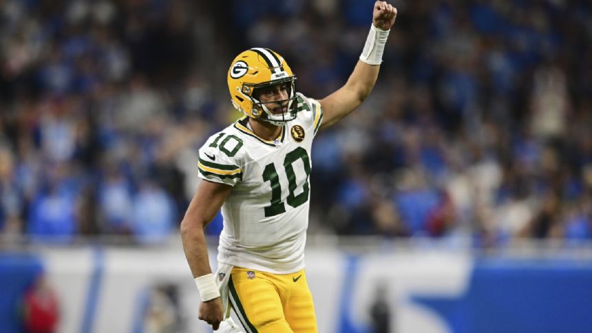 Love ties career high with 3 TD passes, leads Packers to 29-22 win over NFC North-leading Lions