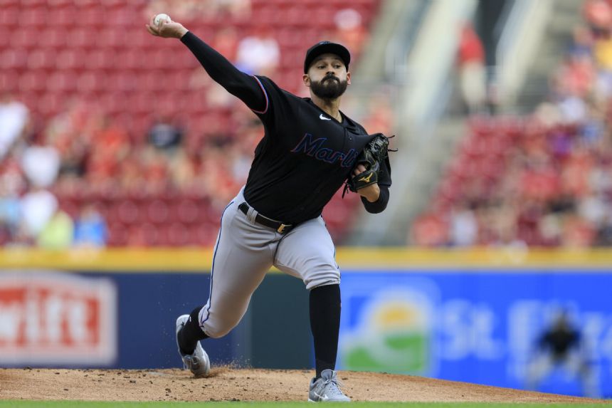 Lopez fans 11 in 7 dominant innings, Marlins edge Reds 2-1