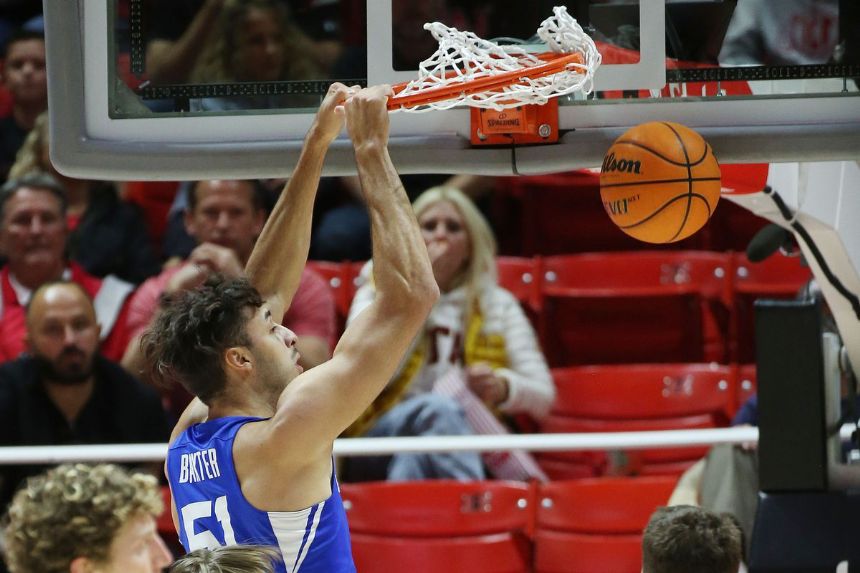Lucas scores 18 points to send No. 18 BYU over Utah 75-64