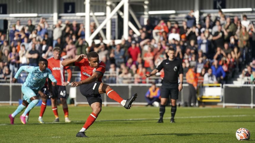Luton earns its first Premier League point in 1-1 draw with 10-man Wolves