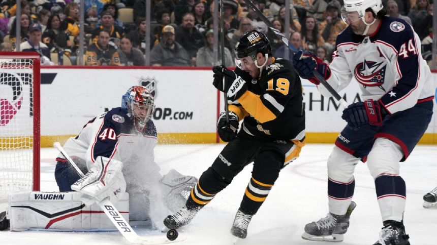 Malkin reaches 20 goals for the 15th time as Penguins edge Columbus 3-2