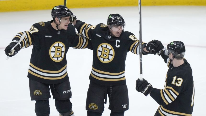 Marchand and Heinen score short-handed, Bruins blank Canucks 4-0 in matchup of NHL's top 2 teams
