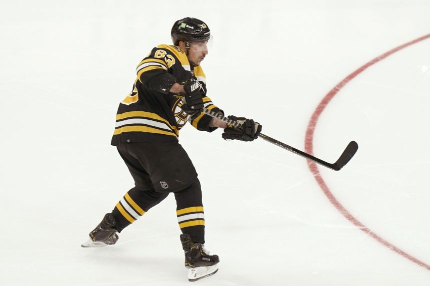 Marchand helps Bruins beat Hurricanes to even series 2-2