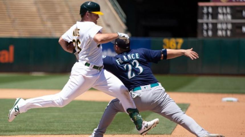Mariners' Ty France leaves game vs. Athletics with apparent arm injury after freak collision