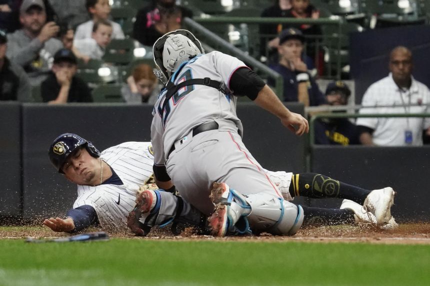 Marlins win in 12, putting Brewers' playoff hopes on ropes
