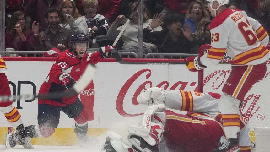 Matthew Phillips scores against his old team, Capitals beat the Flames 3-2 in a shootout
