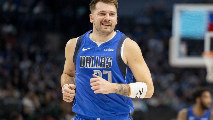 Mavericks to play tournament game on regular floor. Production issues delayed the new court
