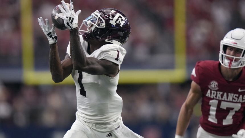 Max Johnson throws 2 TD passes for Texas A&M in 34-22 win as Arkansas held to 174 total yards