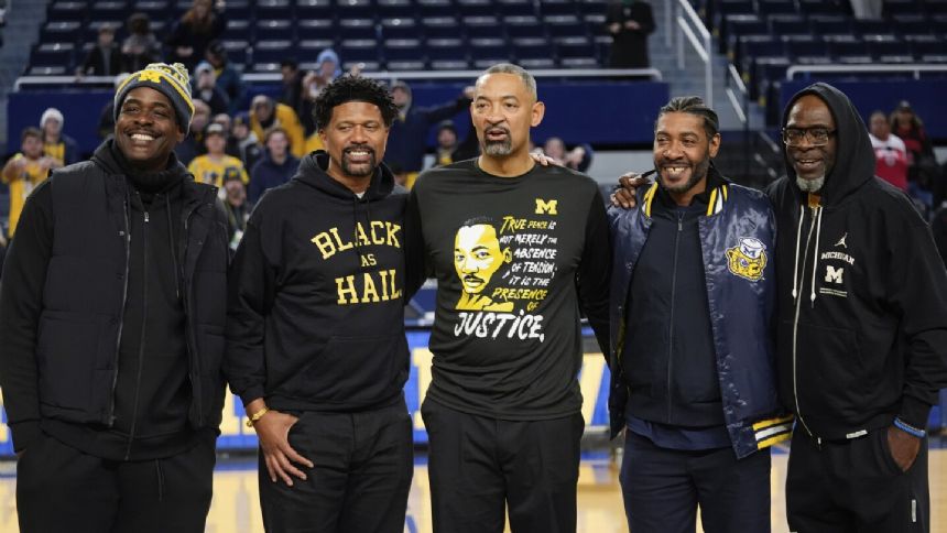 Michigan's Fab Five reunites to support Howard, attends 1st basketball game at Crisler in 3 decades