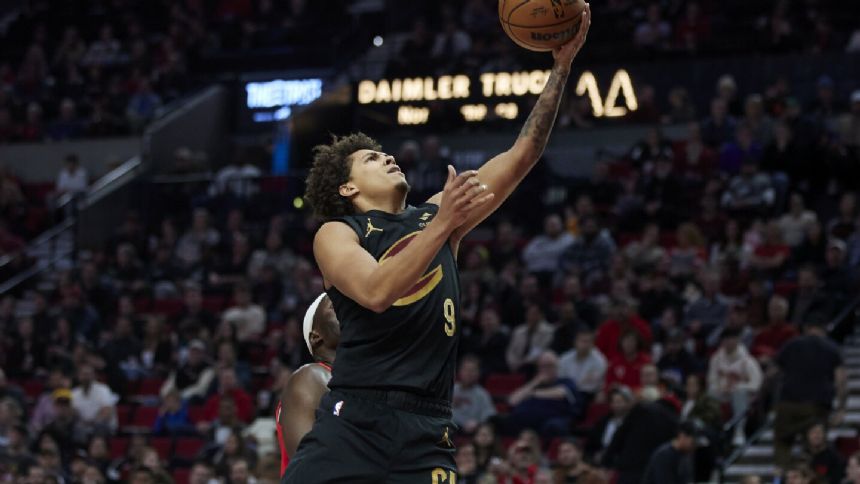 Mitchell has 34 points and Cavaliers end road trip with 109-95 win over Portland