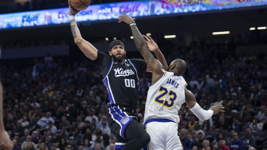 Monk delivers in OT as Kings beat Lakers 132-127 on 20th anniversary of James' NBA debut