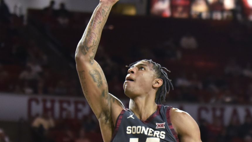 Moore scores 16 as No. 15 Oklahoma pulls away to defeat West Virginia 77-63