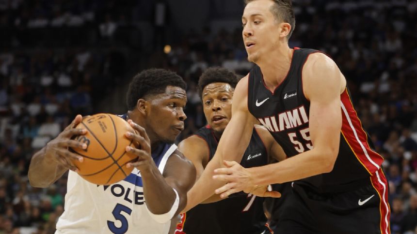 Naz Reid leads Timberwolves in 106-90 takedown of short-handed Heat in home opener