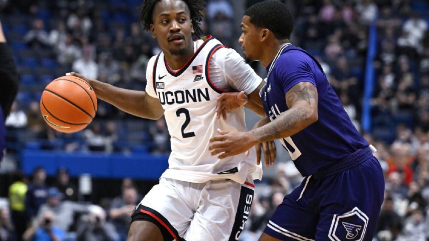 Newton leads five players in double figures in No. 6 UConn's 107-67 rout of Stonehill College