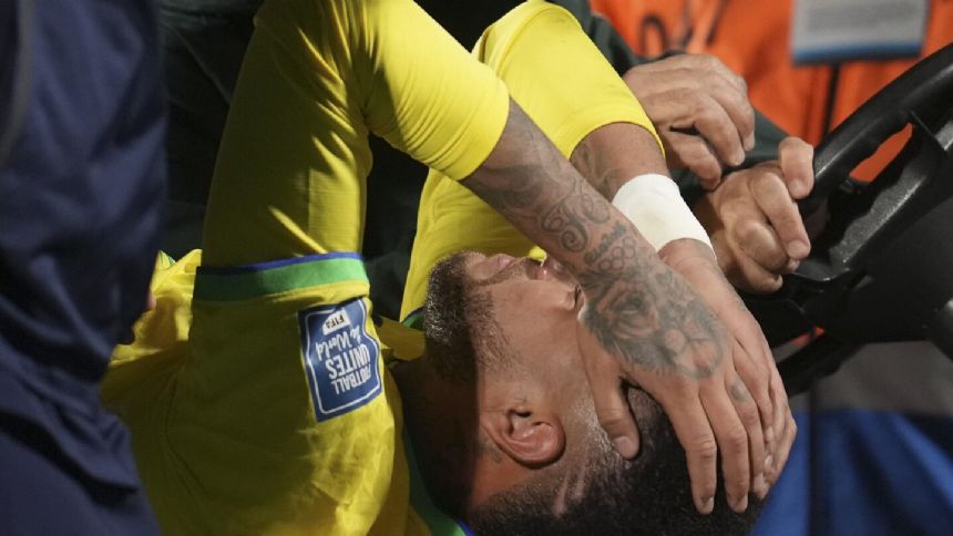 Neymar leaves Brazil match in tears with apparent left knee injury