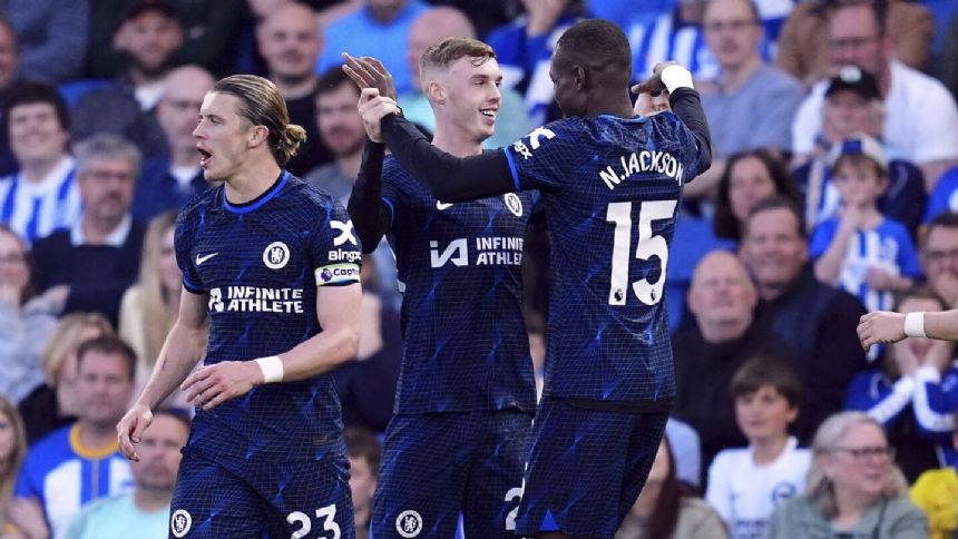 Nkunku inflates blue balloon to celebrate goal in Chelsea's 2-1 win at Brighton in Premier League