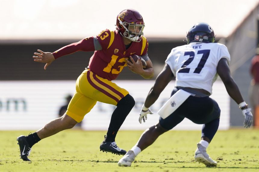 No. 14 USC routs Rice 66-14 in big debuts by Williams, Riley