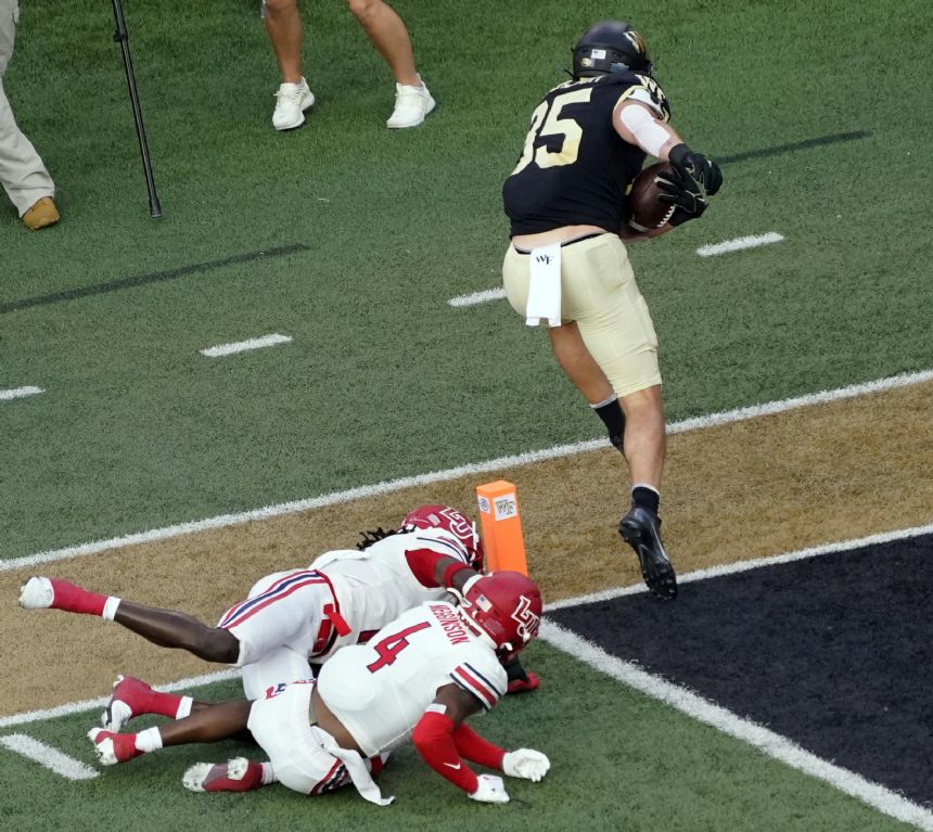 No. 19 Wake Forest stops Liberty's late 2-point conversion